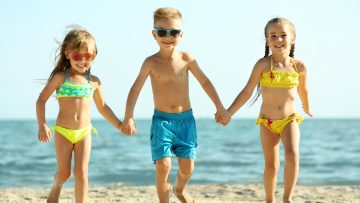 Cute kids having fun on beach